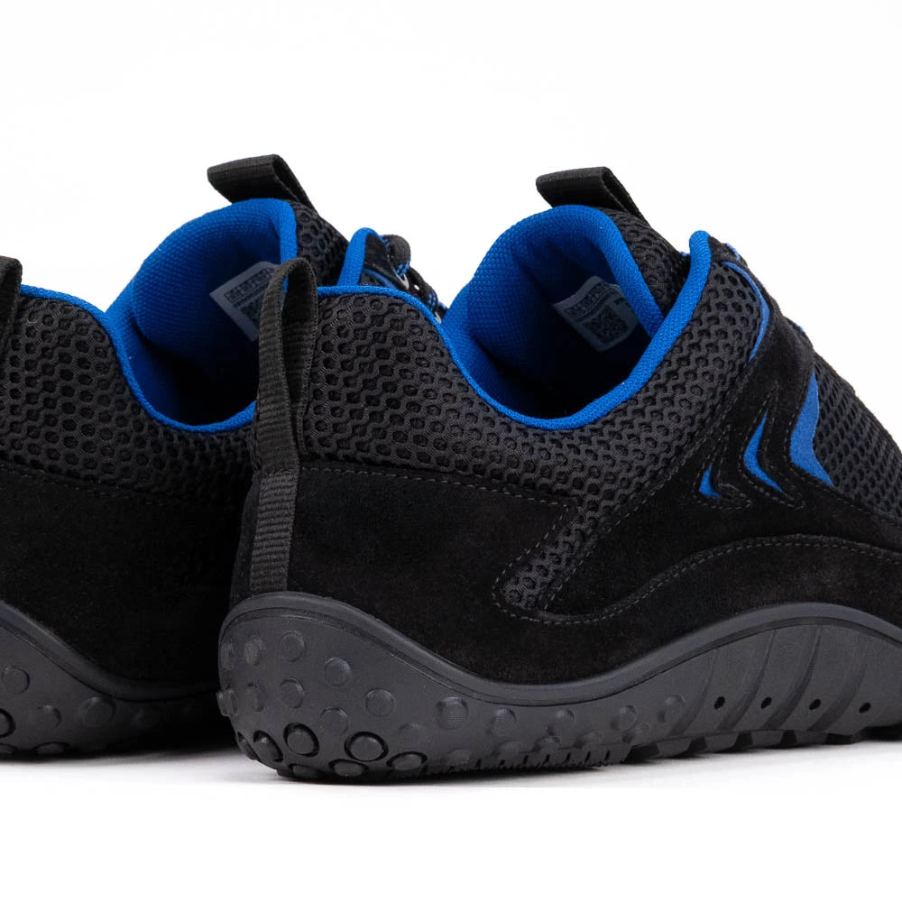 Black and blue athletic shoes on a white background