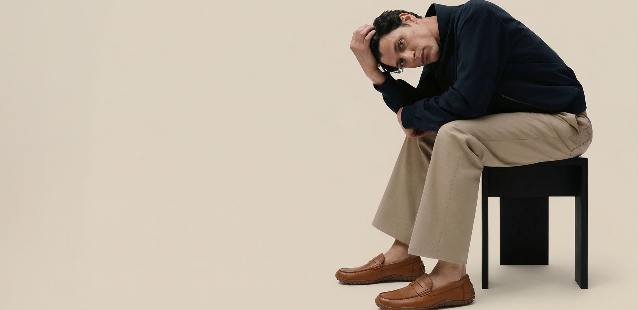 Man wearing brown leather loafer shoe Baer