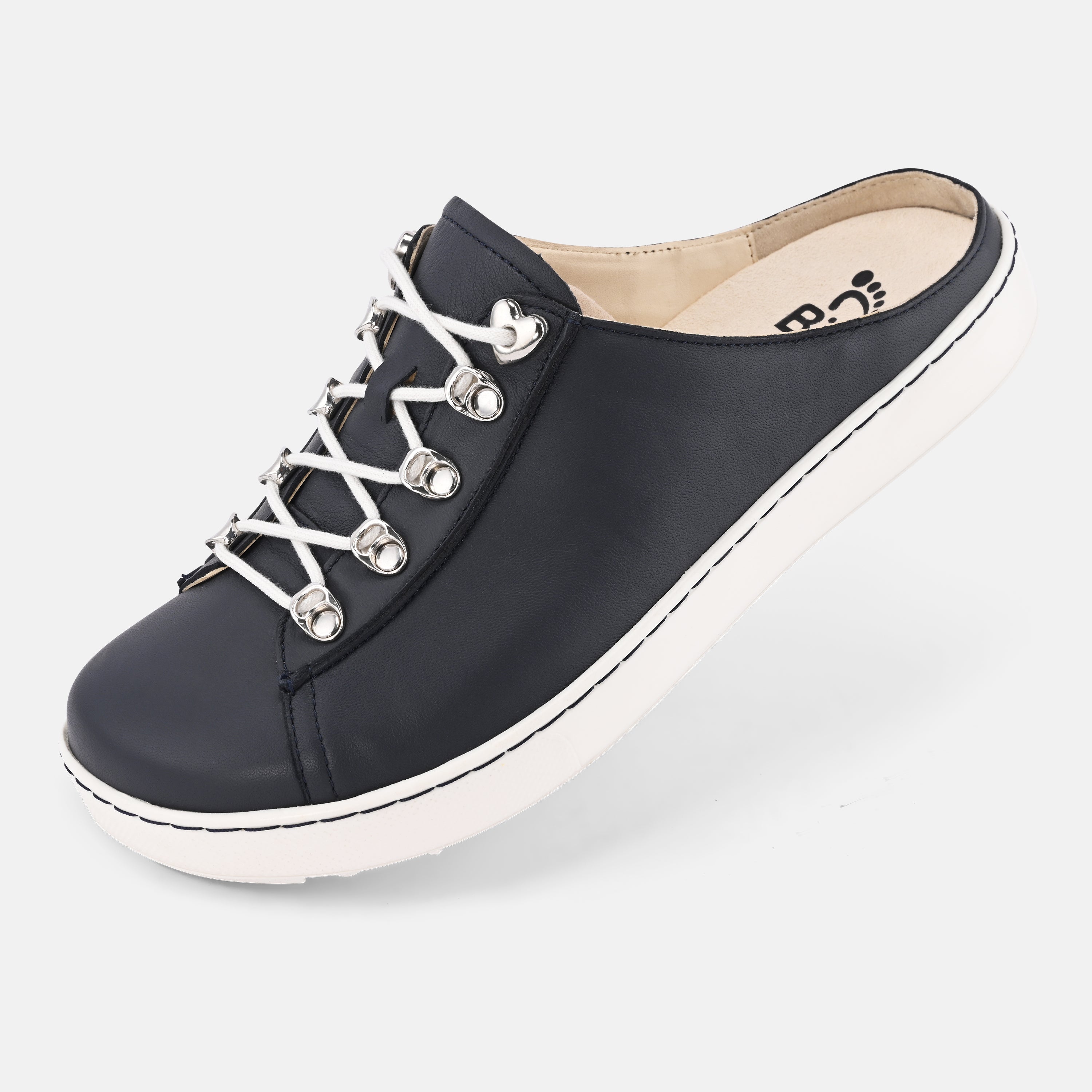 Black slip-on shoe with white sole on a light gray background